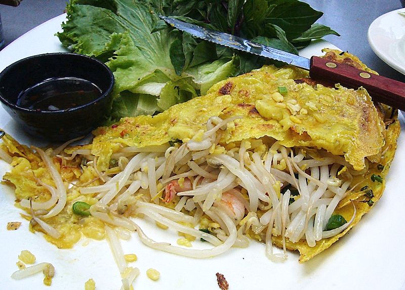 Vietnamese bahn xeo is a crisp and lacy pancake (crepe) that is fried and used as a wrapper for fillings of stir fried prawns, pork and vegetables