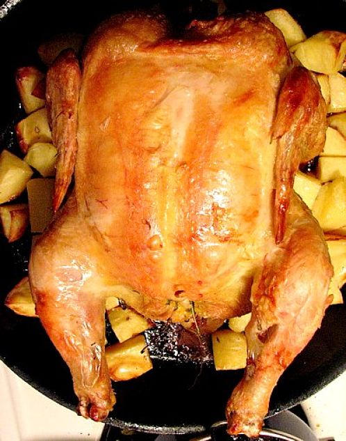 Baked whole chicken ready for serving. Learn how to prepare and cook the perfect baked chicken here