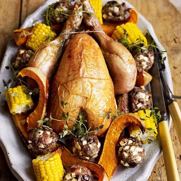 Roast chicken with chestnut and apple stuffing balls - see more recipes here