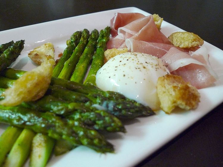 Grilled asparagus pairs very well with eggs and bacon for a delicious breakfast 
