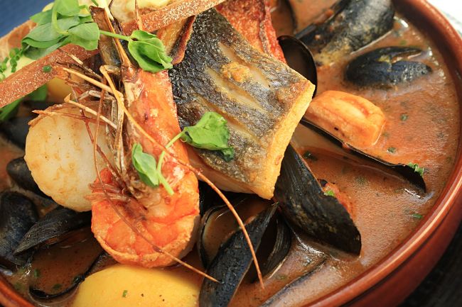 A good fish stew allows the delicate flavors and aroma of the fish and seafood to shine though and remain intact and not be swamped by the herbs, spices or stock