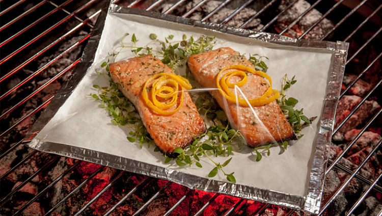 Salmon cooked in special barbecue packets with foil base and oven bag tops to retain moisture