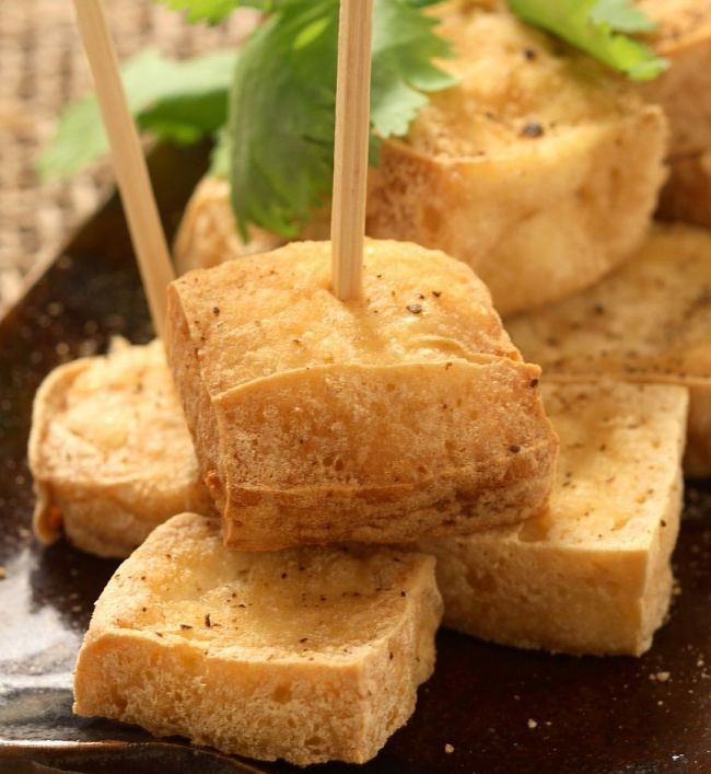 The secrets of making delightful crispy fried tofu is to cook each side for several minutes before turning over. Once crisp the surface will release from the pan surface