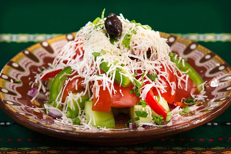 This variation to the Classic Greek Salad recipe is topped with grated cheese