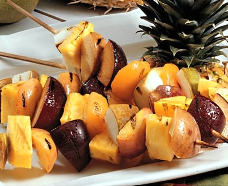 Putting a variety of fruits on metal skewers to sticks is a great way to enjoy barbecued fruit. 