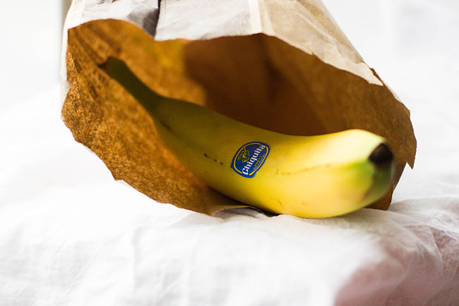 Placing bananas in paper bags, especially with other ripe fruit can help to rpen bananas quickly