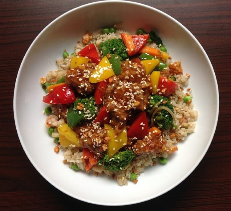 Bell pepper cubes and sesame seeds add to the flavor of fried rice