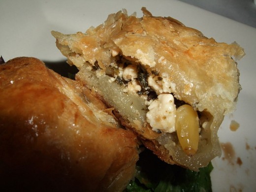 Adding pine nuts to spinach and feta boosts the flavor of spinach puff pies. See the recipe here.