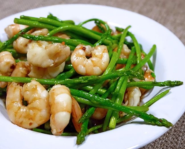Steamed of stir-fried Asparagus is the perfect accompaniment for prawns and other seafood