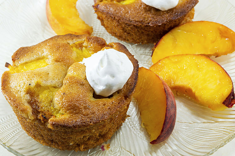 Beautiful peach upside down muffin with the peach incorporated into the cake. 
  Delicious combo of taste, color and texture
