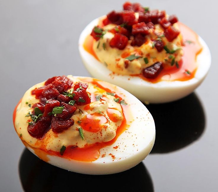 Deviled eggs with crisp fried Spanish chorizo and sherry vinegar, bright red chorizo oil and smoked Spanish paprika