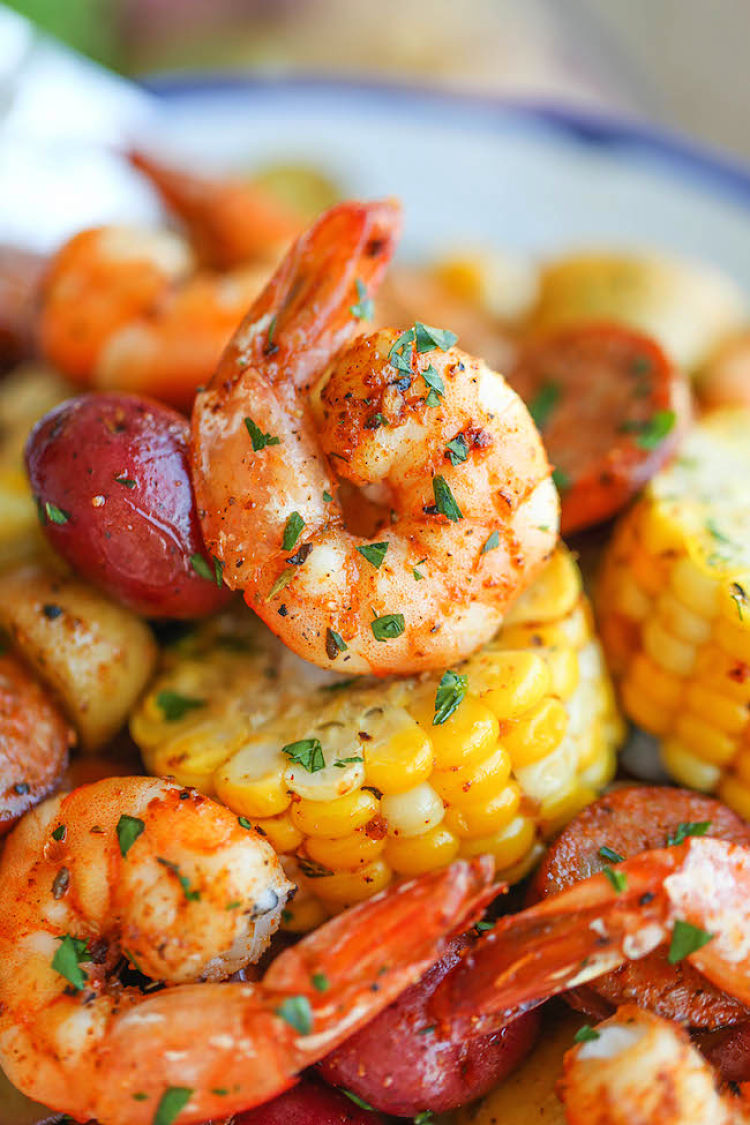 Peeled prawns and mini corn cobs cooked to perfection in a foil packet