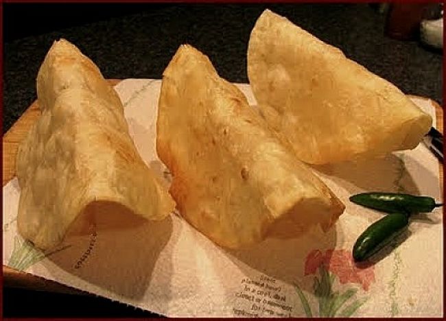 Draining the excess oil from fried homemade taco shells