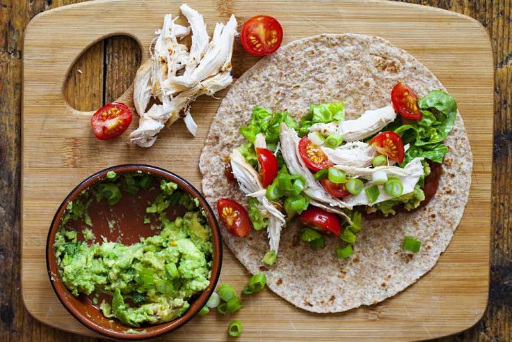 Assembling the healthy and delicious tortillas with fresh salad