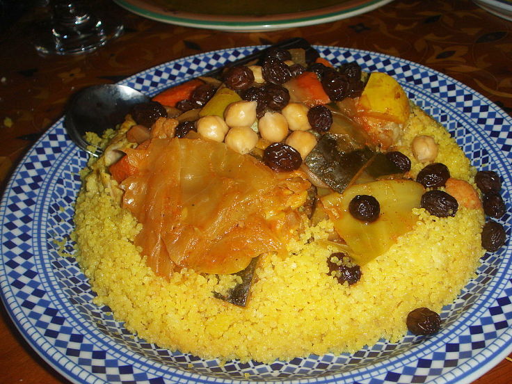 Moroccan Lamb tagine can be served with flat bread or over couscous with beans and lentils.