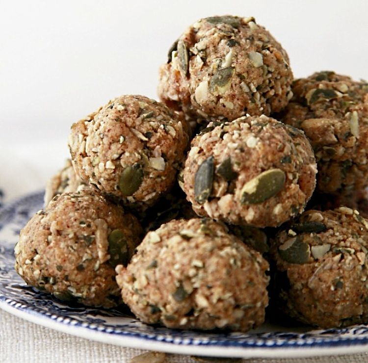Pepitas oats and crushed nuts provide a healthy coating for protein balls adding extra tastes and texture.