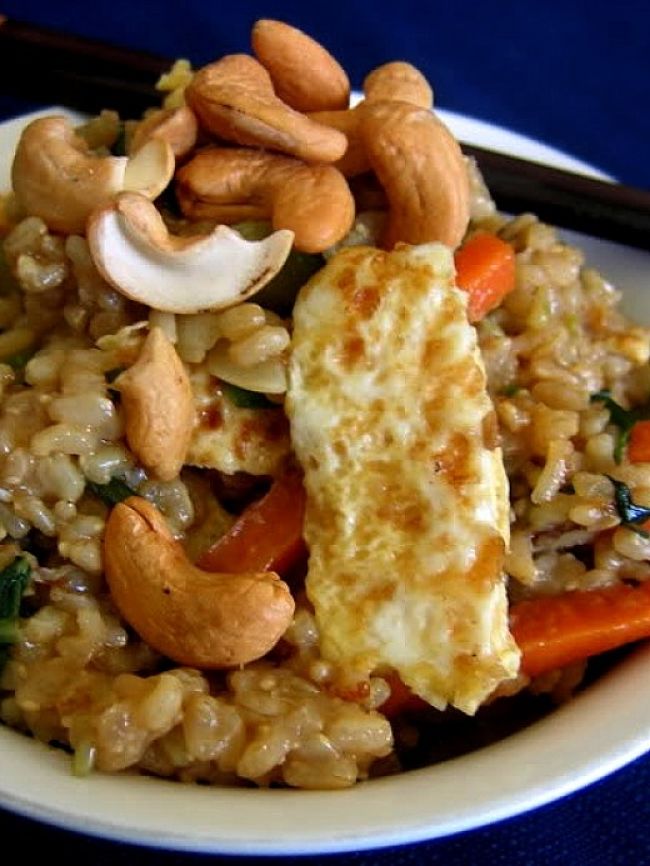 Homemade fried rice can include a huge variety of meats, nuts and vegetables that can be healthy choices for a wholefoods meal.