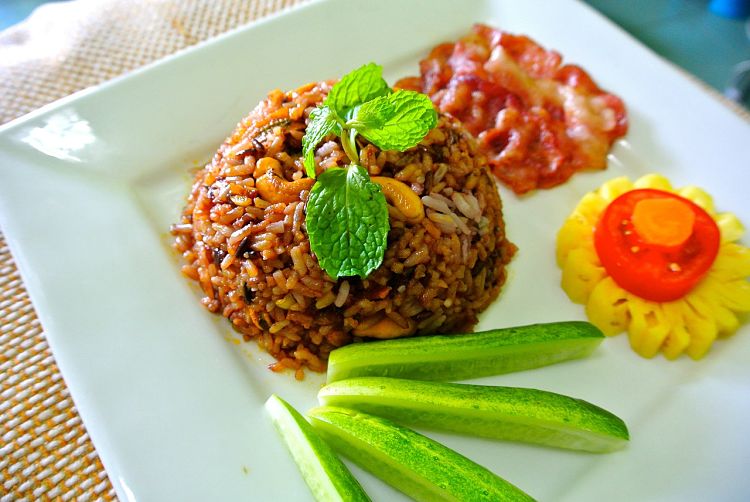 Fried rice can be served as a side dish with other items in a meal.